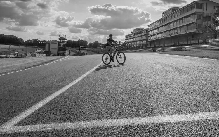 Cyclist riding the track before a weekend meet